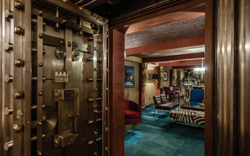 Original vault door, restored, opens to a private dining space