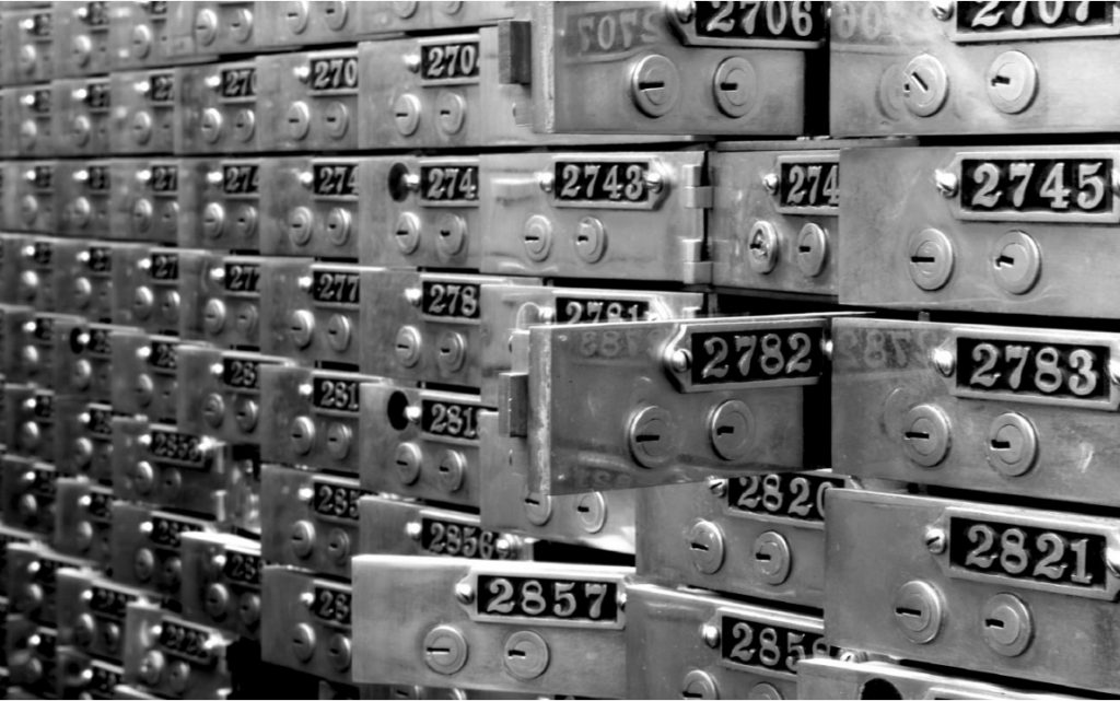 Original safe deposit boxes in front of the bar